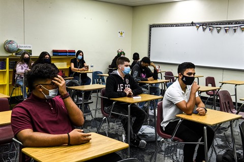 some universities and schools are reinstating the wearing of a mandatory mask indoors